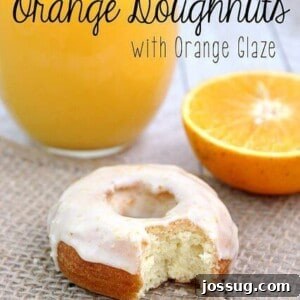 Citrus Sunshine Doughnuts 2 Homemade Orange Doughnuts with Zesty Orange Glaze on a cooling rack