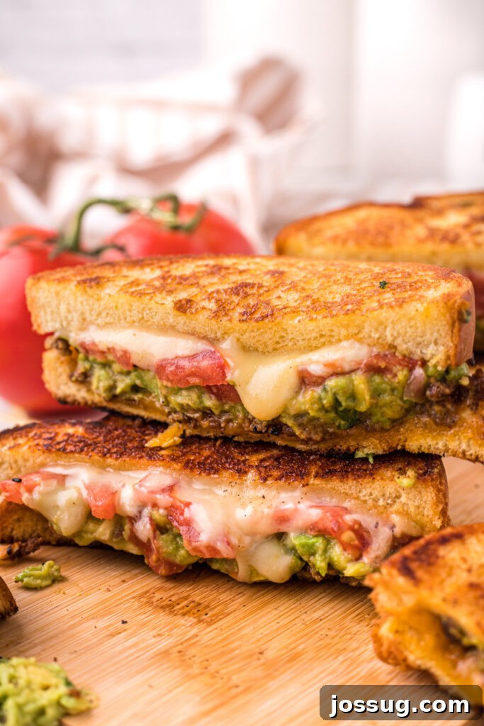 Grilled Taco Melt 3 two halves of a grilled cheese sandwich stacked on a plate