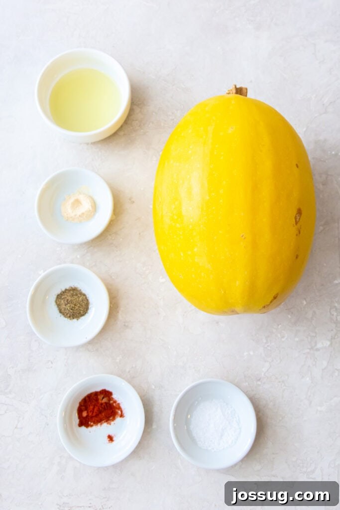 Whole spaghetti squash with small bowls of oil, salt, pepper, paprika, garlic powder, and Italian seasoning on a light background.