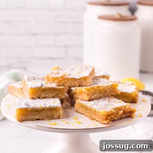 lemon bars on cake stand