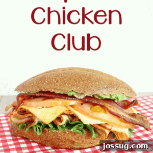 Delicious Chipotle Chicken Club sandwich on a wooden board with ingredients
