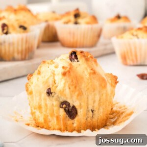 irish soda muffin with the paper peeled down