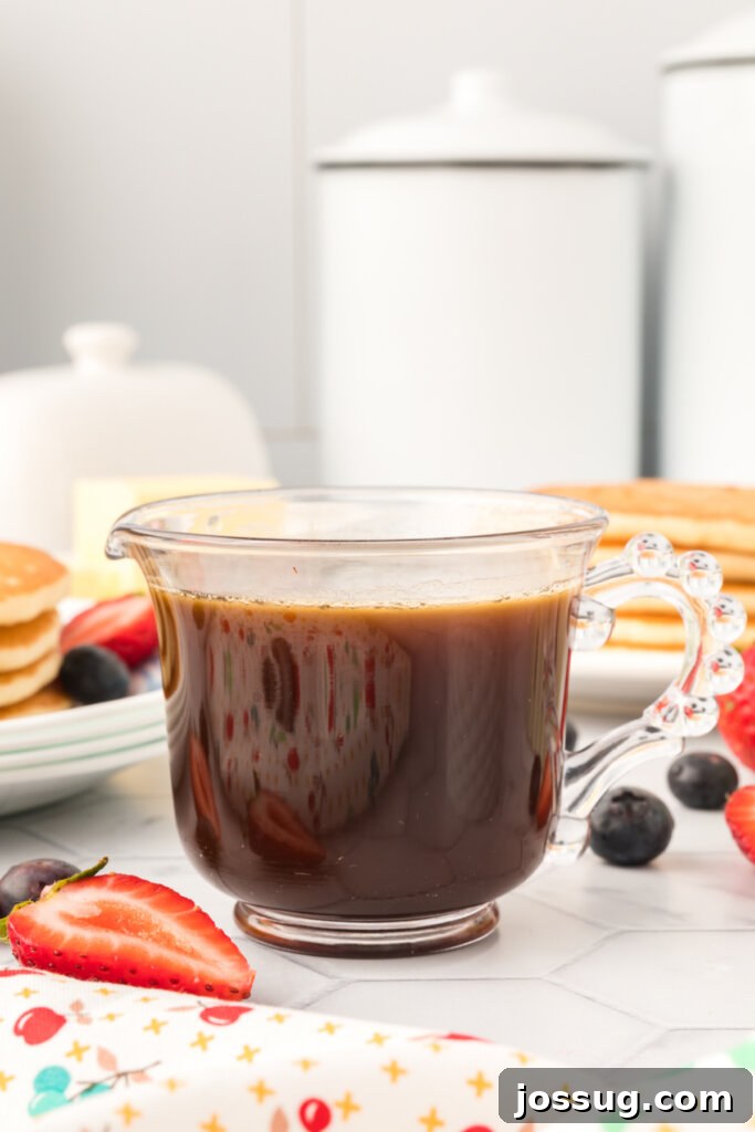 Golden Vanilla Pancake Nectar 2 Glass container filled with rich homemade vanilla pancake syrup, ready to be served over breakfast delights.