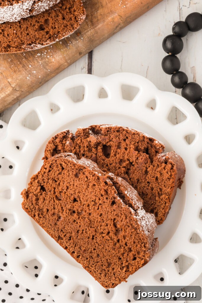 Two Decadent Slices of Chocolate Pound Cake on a White Plate