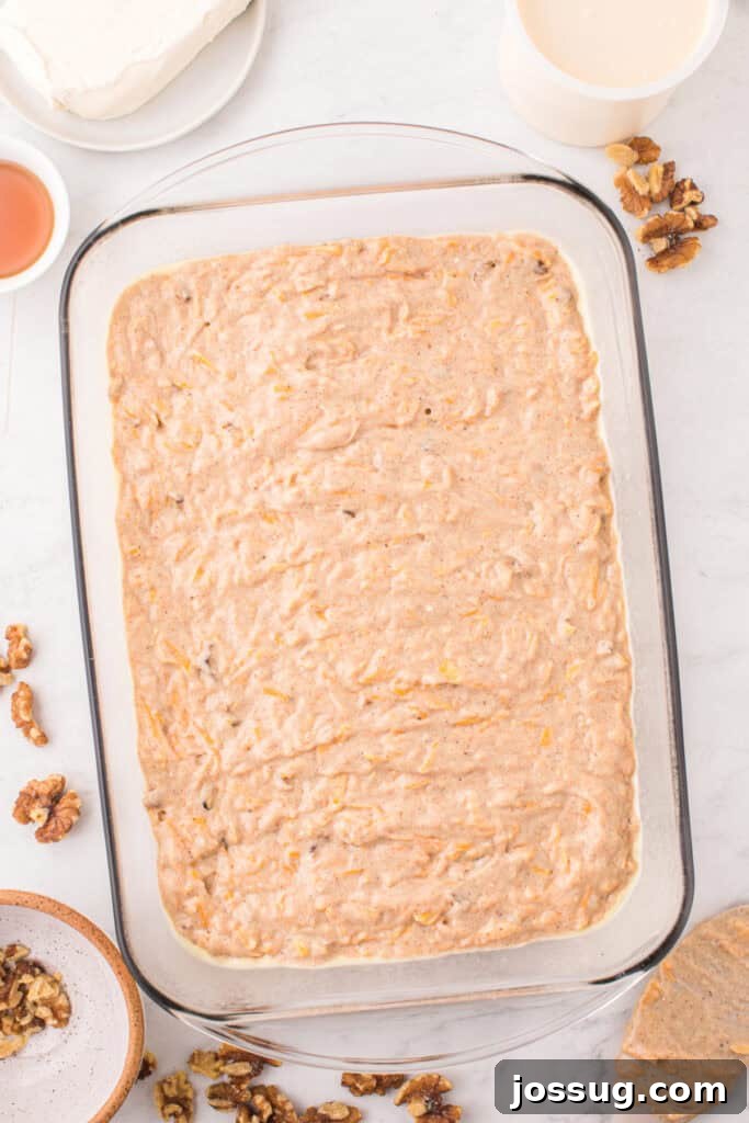 Spiced Golden Butternut Cake 8 A clear glass baking dish holds the smooth butternut squash cake batter, perfectly prepped before its journey into the oven.