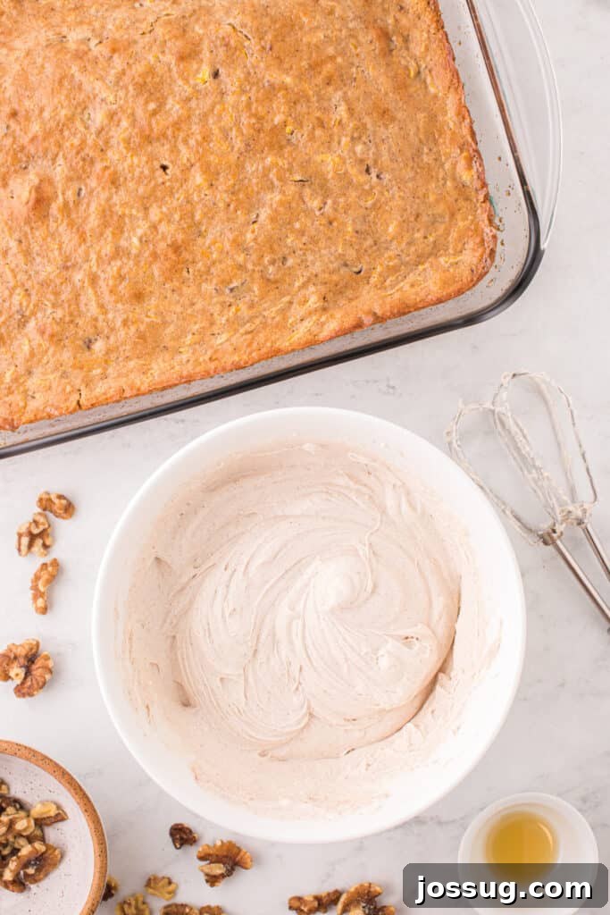 Spiced Golden Butternut Cake 10 A bowl of smooth, fluffy cream cheese frosting sits ready beside the perfectly cooled butternut squash cake, anticipating its final flourish.