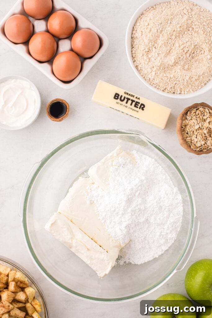Softened cream cheese and powdered sugar in a large glass mixing bowl, ready for beating.