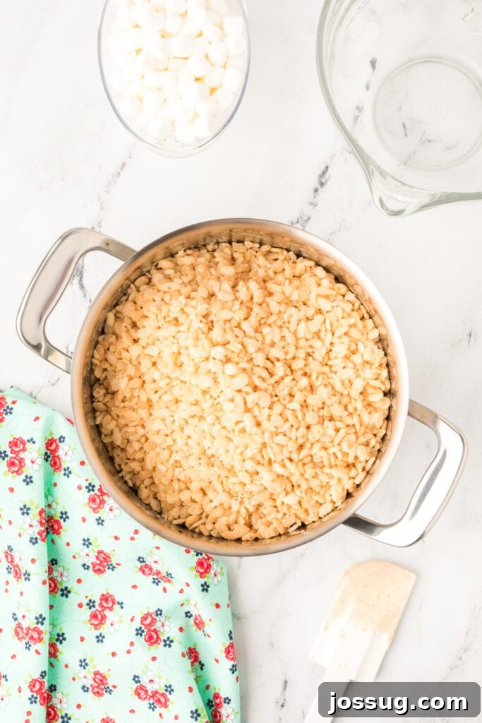 Caramelized Butter Rice Crisps 8 Crispy rice cereal poured into the pot of melted marshmallow and browned butter mixture.