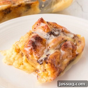 Square image of cinnamon roll casserole on a plate