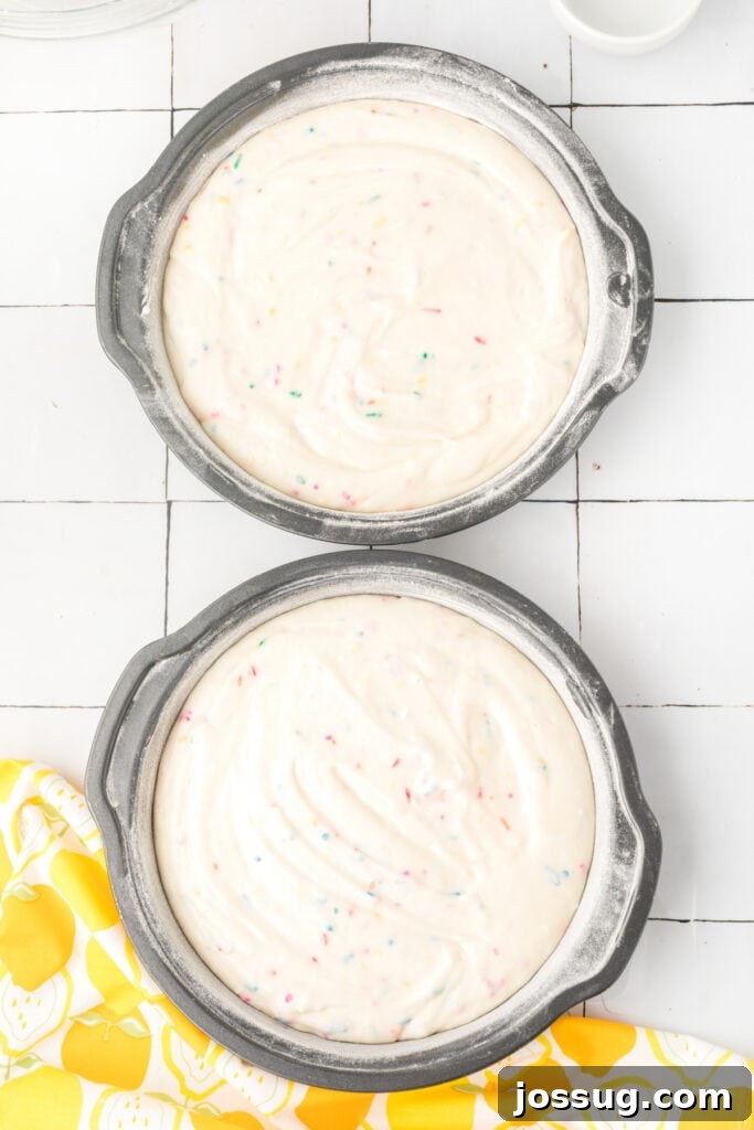 Whimsical Lemon Sprinkle Cake 6 Lemon Funfetti Cake batter in greased and floured pans