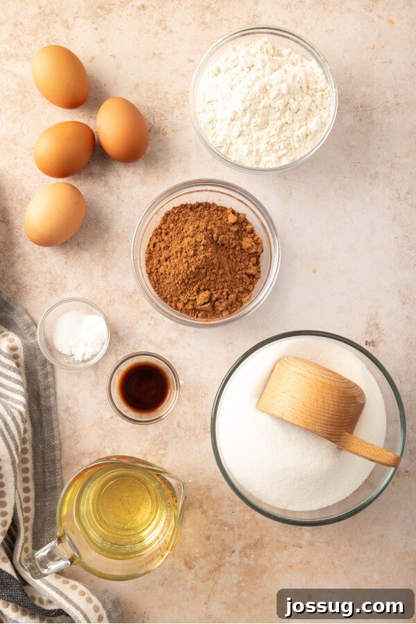 Foolproof Homemade Chocolate Brownies 3 Essential ingredients for baking homemade chocolate brownies laid out on a surface
