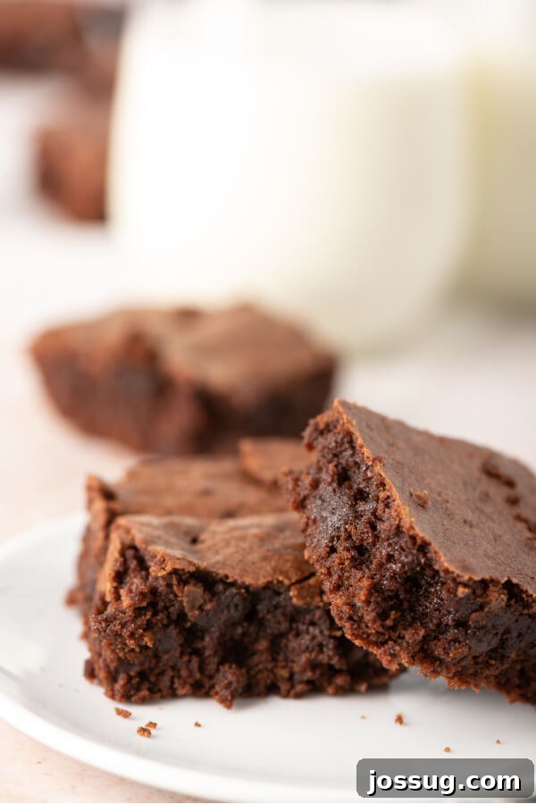 Foolproof Homemade Chocolate Brownies 7 Stack of rich chocolate brownies on a white plate