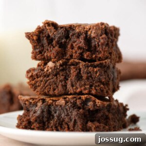 three brownies stacked on a plate