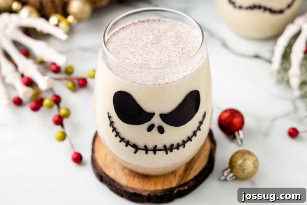Wide shot of a Jack Skellington Cocktail served in a themed glass on a wooden coaster, with festive decor around, highlighting the perfect party presentation.