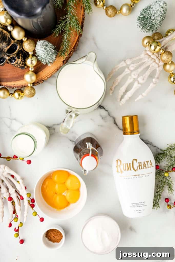 Overhead photo of cocktail ingredients including RumChata, eggs, sugar, milk, cream, pumpkin spice, and vanilla surrounded by festive Halloween and Christmas decorations, illustrating the delightful blend of holiday themes.