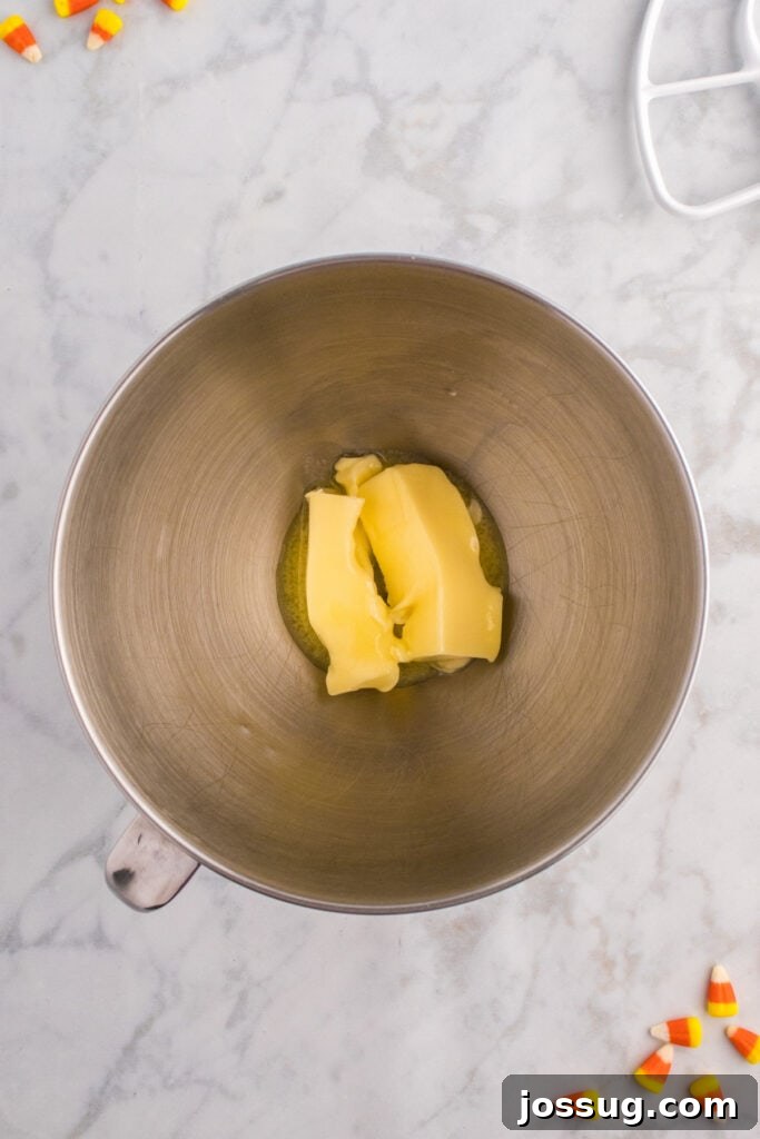 Mixing bowl with softened butter ready to be creamed for cupcake batter.