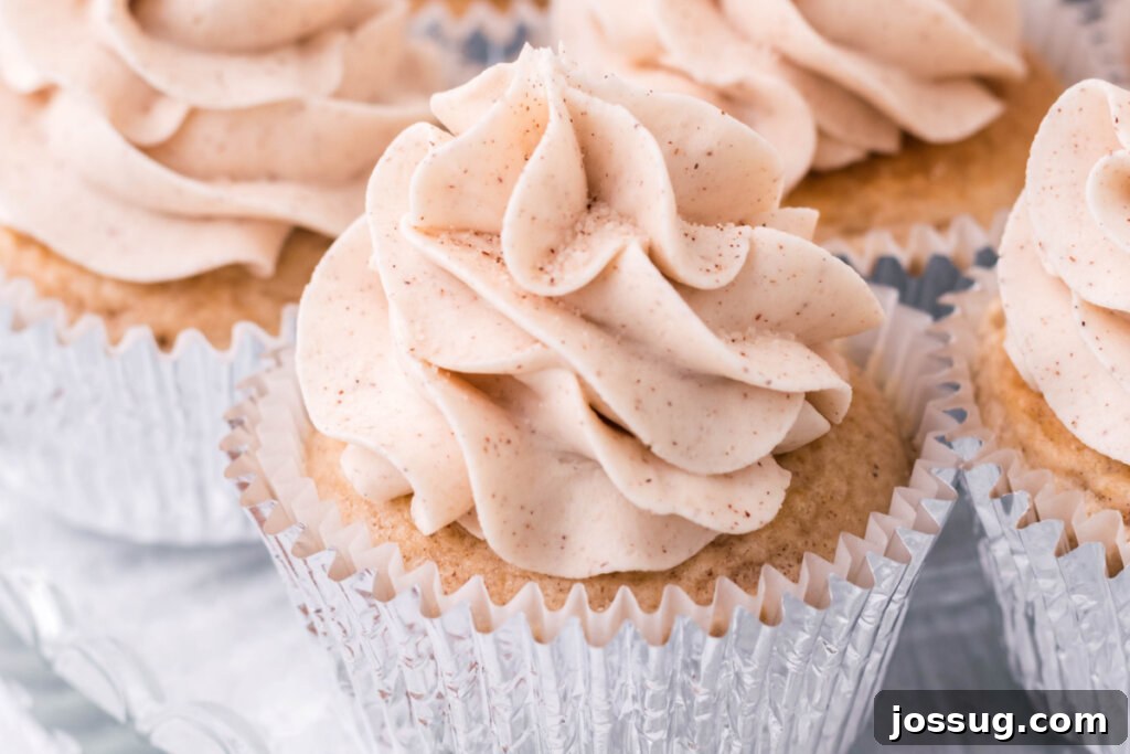 Close-up of a single cinnamon cupcake in an aluminum wrapper