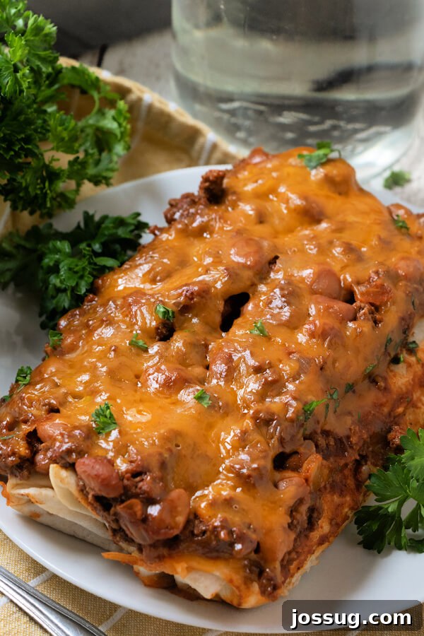 Cheesy Chili Dog Bake 5 finished chili dog casserole on a plate with melted cheese
