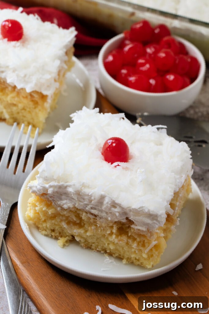 Piña Colada Paradise Cake 3 Slices of Piña Colada Poke Cake on plates
