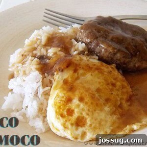 Authentic Hawaiian Loco Moco Recipe A classic Loco Moco dish featuring white rice, a hamburger patty, a fried egg, and brown gravy