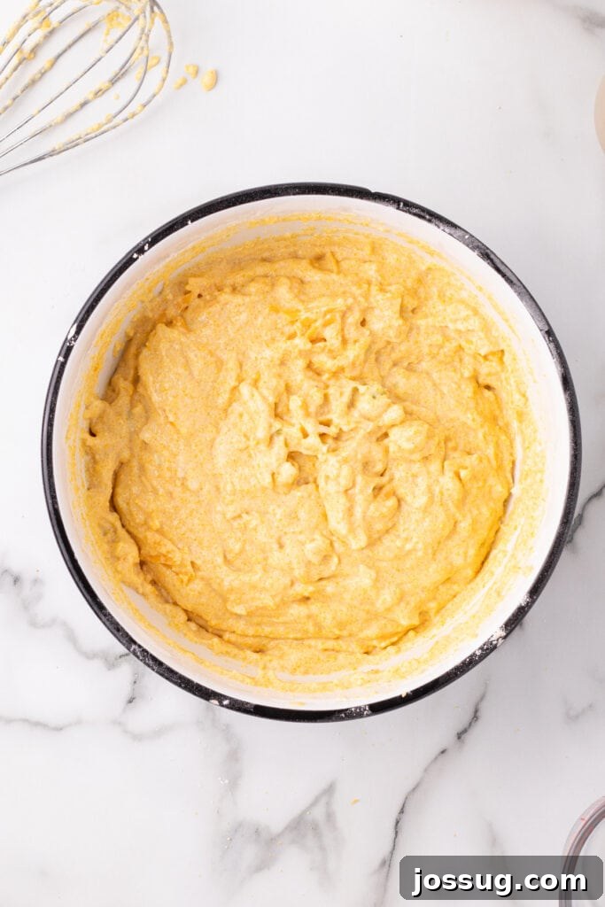 Savory Cheddar Onion Cornbread 8 Final Cheddar Onion Cornbread batter fully mixed and ready to pour into the skillet.