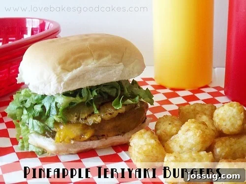 Juicy pineapple teriyaki burger with melted cheese, grilled pineapple, and shredded lettuce, served with a side of crispy tater tots.