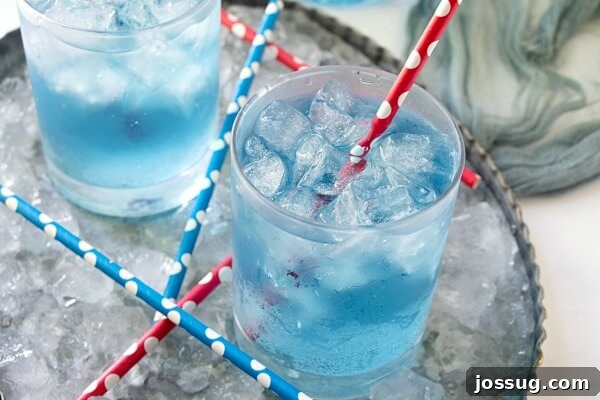 Craft Your Own Sonic Ocean Water 3 A close-up of glasses filled with homemade Sonic Ocean Water, sparkling with ice and bubbles.