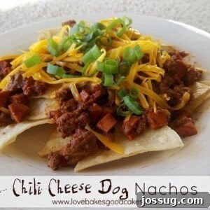 Loaded Hot Dog Chili Cheese Nachos 2 A platter of delicious Chili Cheese Dog Nachos with green onions and sour cream drizzle