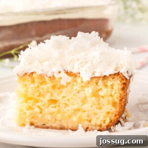 slice of coconut cream poke cake on plate