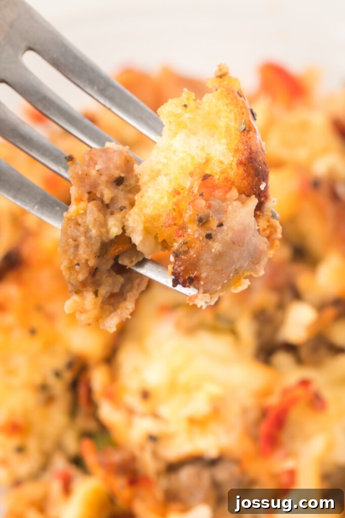 A close-up of Italian Breakfast Strata on a fork, showing the texture and delicious ingredients