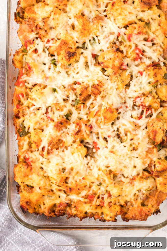 Italian Breakfast Strata baking in a glass dish, showing its golden-brown top