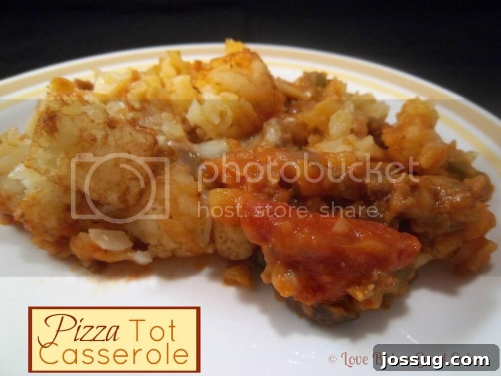 Delicious Pizza Tot Casserole on a white plate, served close up and ready to eat.