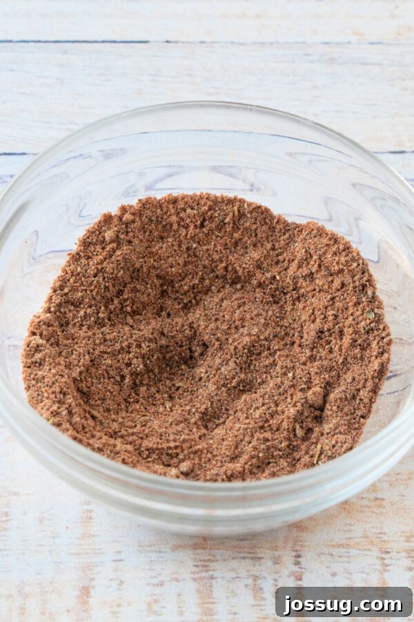 DIY Taco Spice Mix 5 A glass bowl filled with all the combined spices for homemade taco seasoning, ready for storage or use
