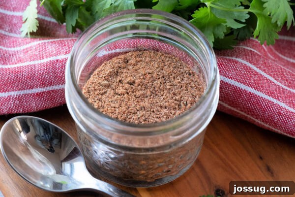 DIY Taco Spice Mix 9 A glass jar of homemade taco seasoning with a cork lid, ready for easy access in the kitchen