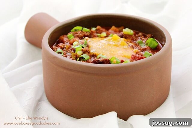 Ring in 2013: 2012's Top Soup and Bread Recipes 2 Hearty Chili resembling Wendy's famous recipe, served generously in a white bowl with toppings