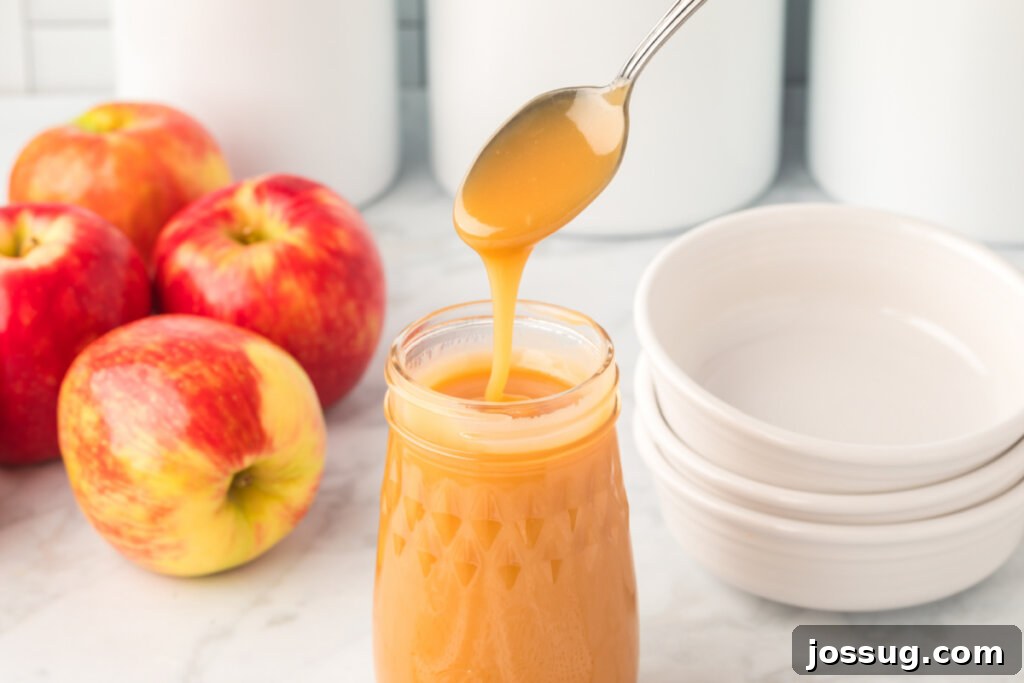 Decadent Caramel 6 A jar of rich, homemade caramel sauce, perfectly golden and smooth.