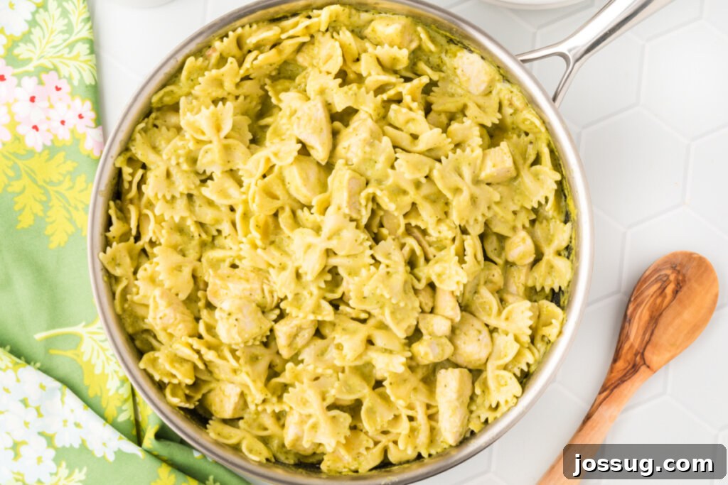 finished creamy chicken pesto pasta in skillet