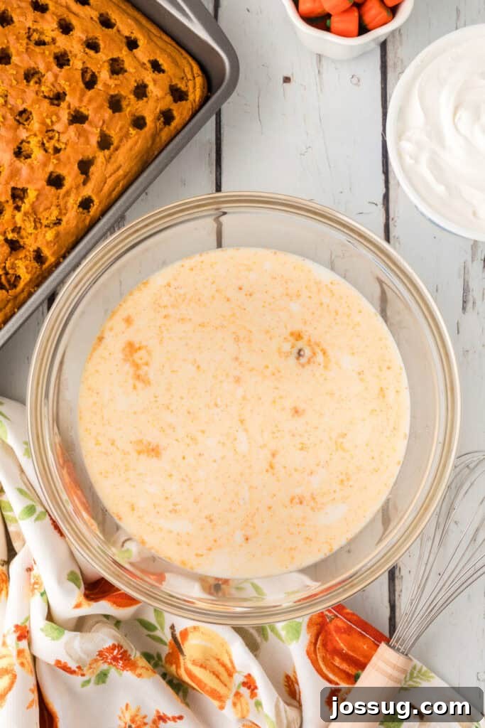 Decadent Pumpkin Spice Poke Cake 9 Bowl of milk and pudding mix before whisking for filling