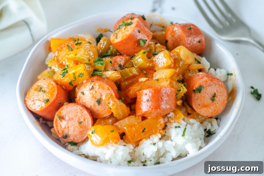sweet & sour hot dogs over rice in bowl