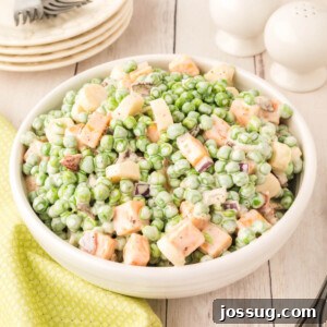 creamy pea salad in white bowl, a side dish for any occasion