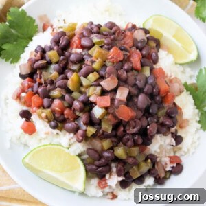 Delicious Cuban Black Beans and Rice with a side of lime wedges