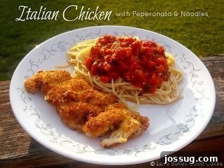 A plate of Italian Chicken with Peperonata and Noodles, garnished with fresh basil.
