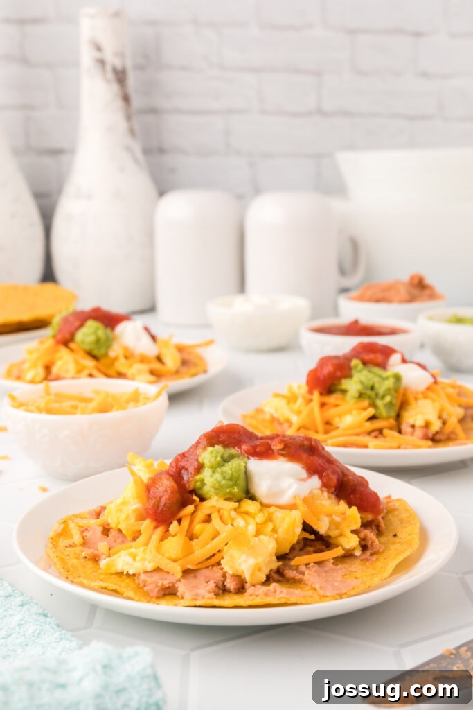 Crispy Morning Fiesta 4 Three colorful breakfast tostadas served on white plates, each with various toppings, illustrating customization options.
