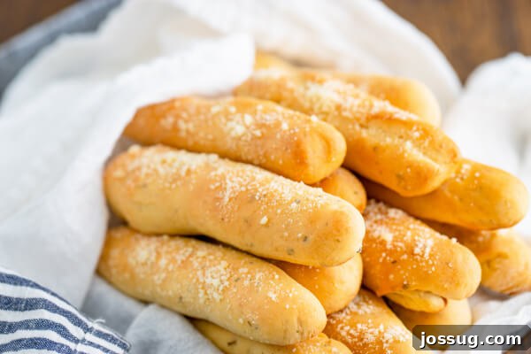 A perfectly arranged basket brimming with delicious Soft Italian Breadsticks, ready for serving.