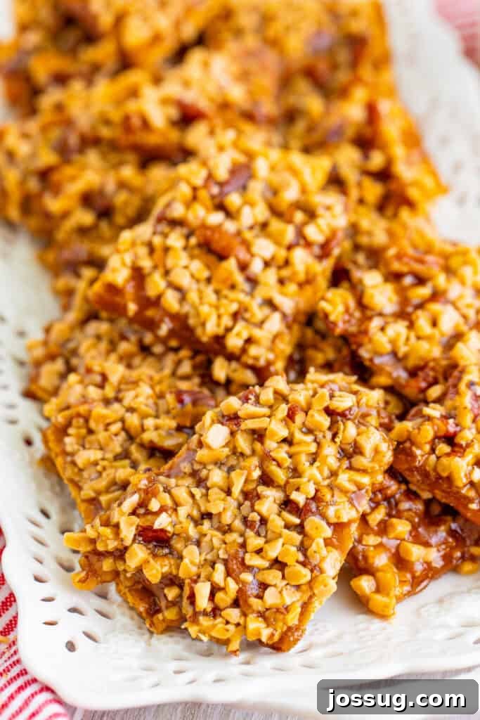 Toffee Graham Bliss Bites 2 Close up of toffee graham cracker pralines showing crunchy toffee bits and caramel-coated pecans