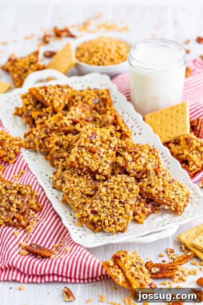 Toffee Graham Bliss Bites 11 Platter of toffee graham cracker pralines arranged with a glass of milk and scattered graham crackers