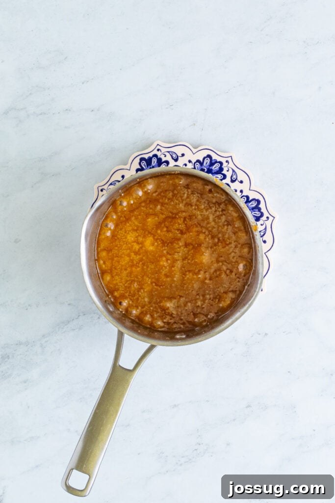Toffee Graham Bliss Bites 4 Melted butter and brown sugar mixture bubbling in a saucepan as it begins to turn into caramel