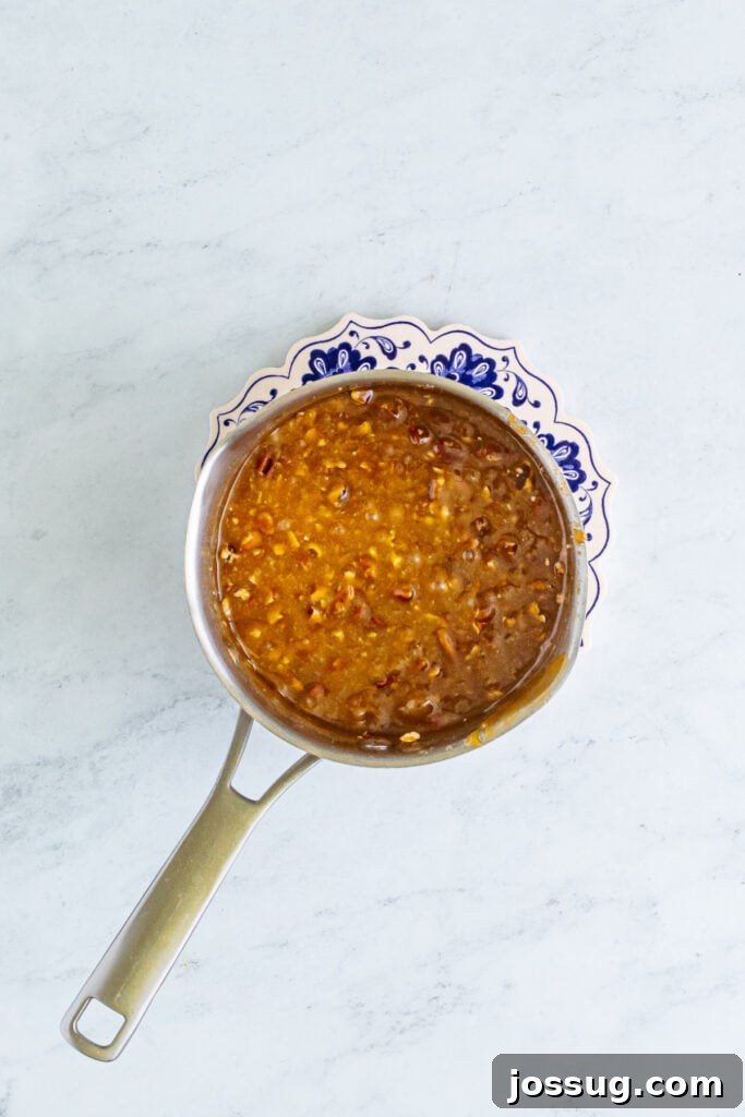 Toffee Graham Bliss Bites 5 Saucepan of boiling caramel with chopped pecans stirred in