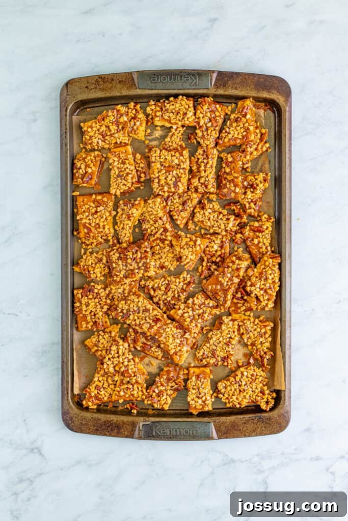 Toffee Graham Bliss Bites 10 Cooled sheet of toffee graham cracker pralines broken into individual pieces on a baking sheet
