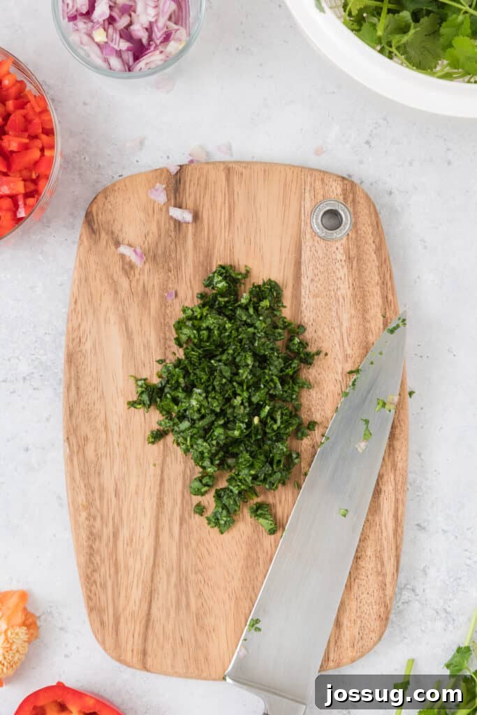 Mango Salsa Delight 3 Chopped cilantro, onions, and peppers on a cutting board